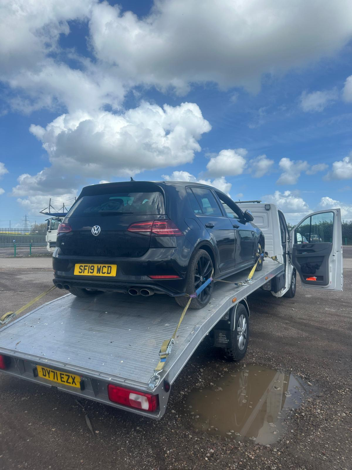 Black Volkswagen Golf R strapped down for nationwide vehicle transport