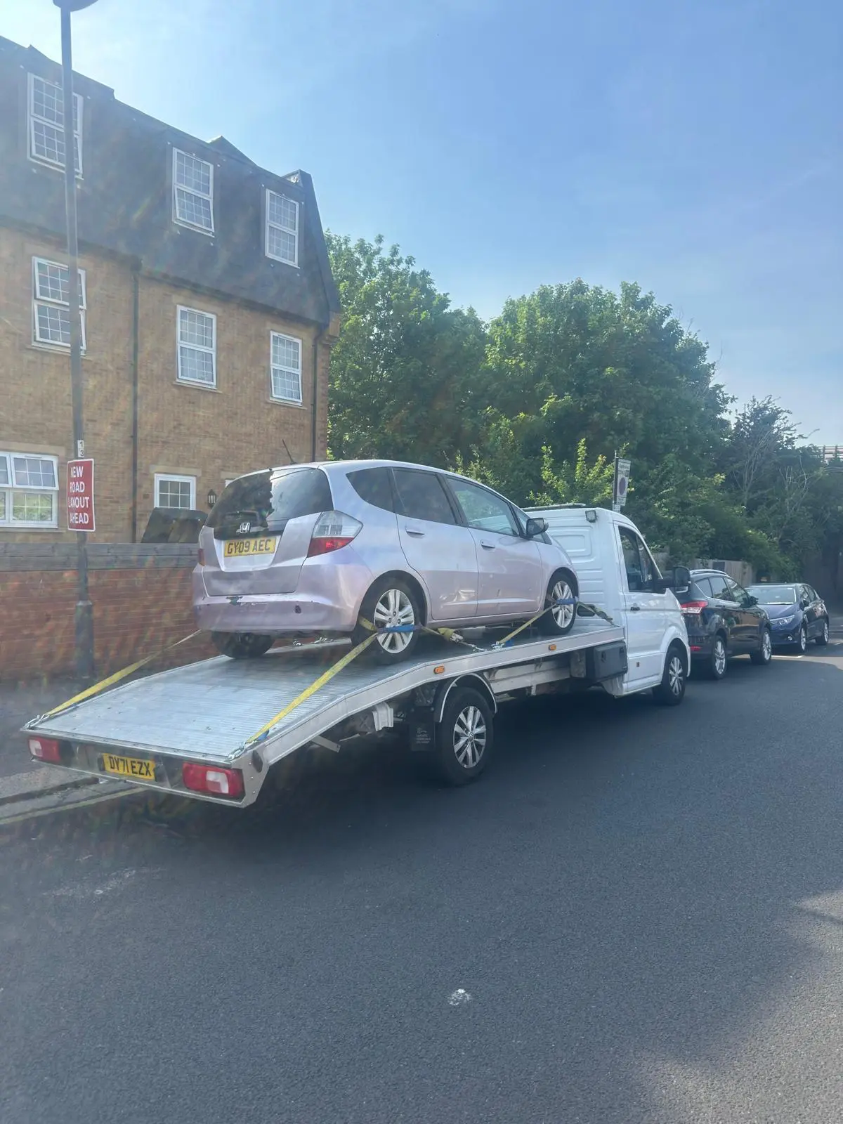 Honda Jazz collected on a residential street for 24/7 vehicle recovery