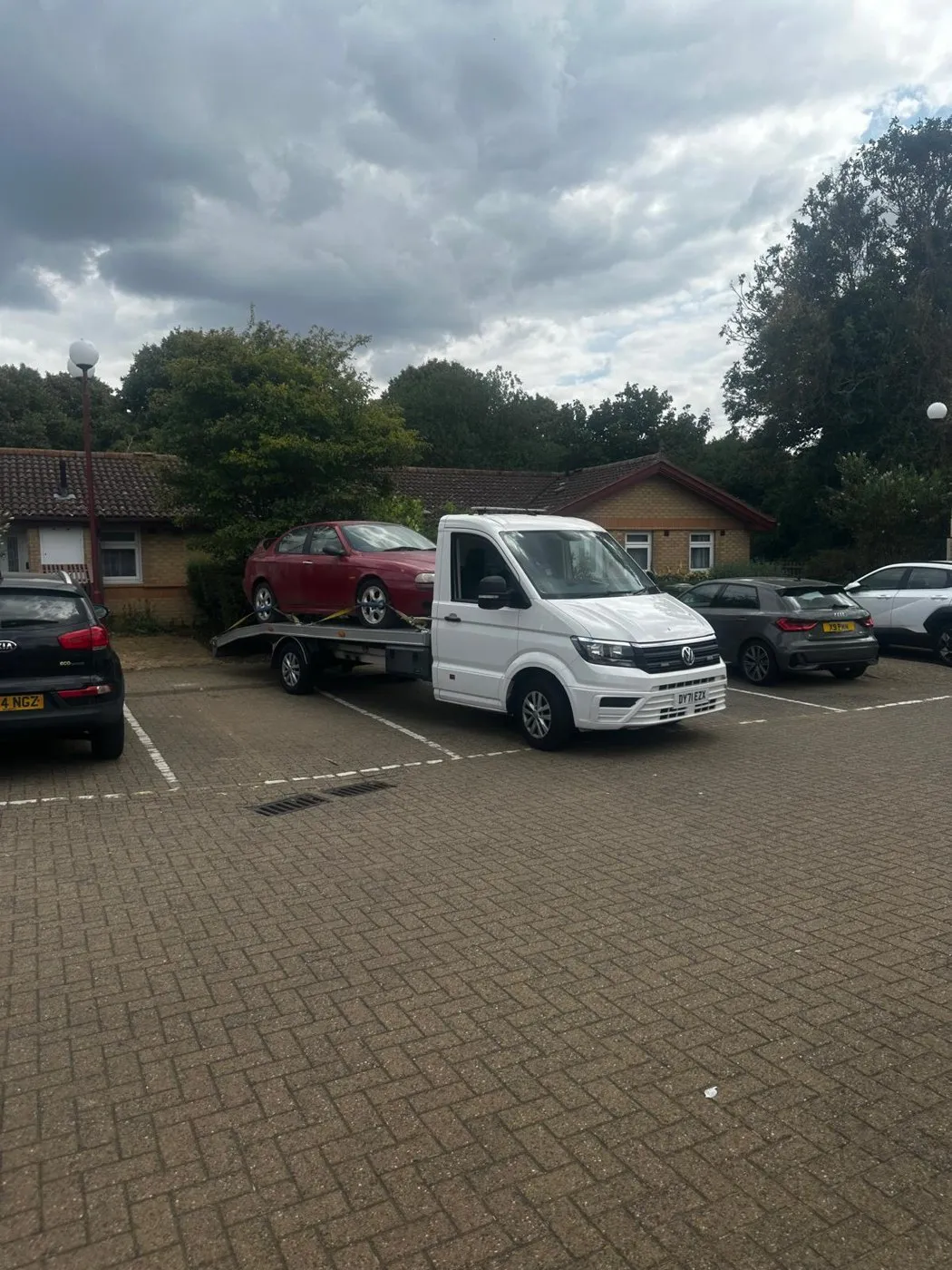 Car secured on the tilt-and-slide bed ready for nationwide vehicle transport